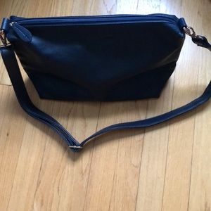 Navy Leather shoulder bag. New. Inside and outside zipper pockets.